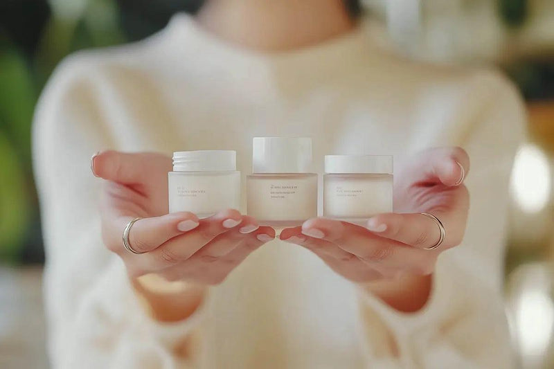Woman holds korean skincare cosmetics 